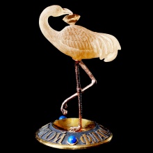 itrine carved logo of the Golden Flamingo brand