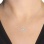 14K white gold toggle necklace with 6 diamonds on a woman
