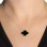 Designer Necklace with Black Onyx Four-leaf Clover on a Model