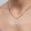 Diamond crucifix pendant 'The Spirit of The God' on a woman. Chain is not included in purchase price.