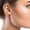 Gold Earrings with a 9mm Statement Garnet on a Model
